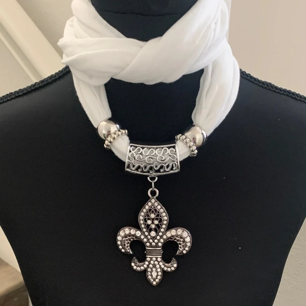 NWOT Chic White Scarf Necklace with Fleur-de-Lis Pendant.